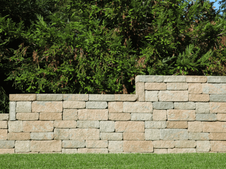Reinforcing a Failing Retaining Wall Before It Reaches Your Brookhaven Foundation